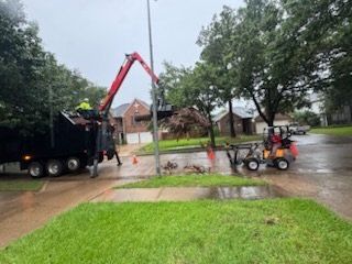 Grapple debris truck loading storm debris
